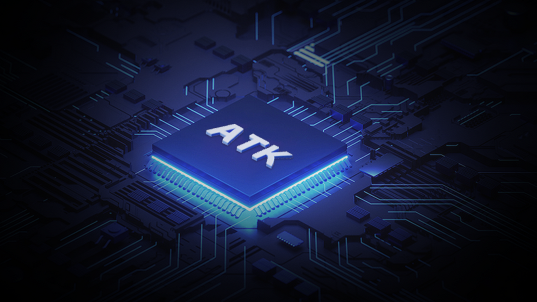 A glowing blue "ATK" processor chip on a dark circuit board.