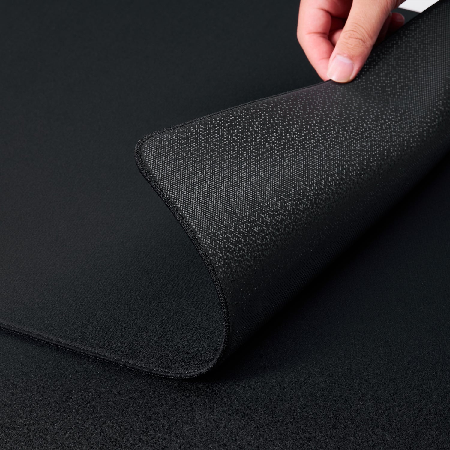 ATK X83 XSoft gaming mousepad showing the Poron polyurethane non-slip base with textured grip.