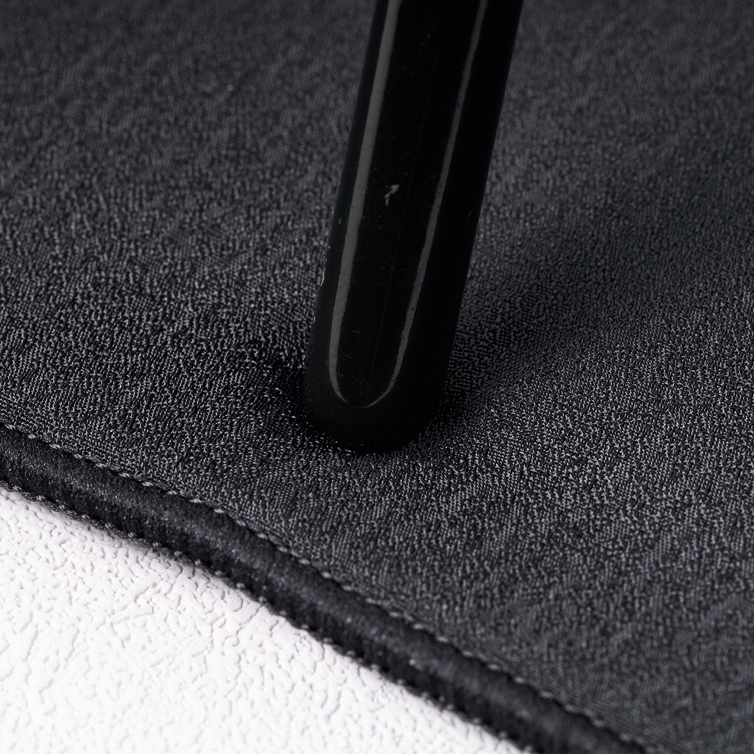 ATK X83 XSoft gaming mousepad with textured surface and stitched edge.