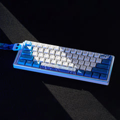 ATK EDGE 60HE Leviathan collaboration gaming keyboard, white with blue PBT keycaps and custom graphics.
