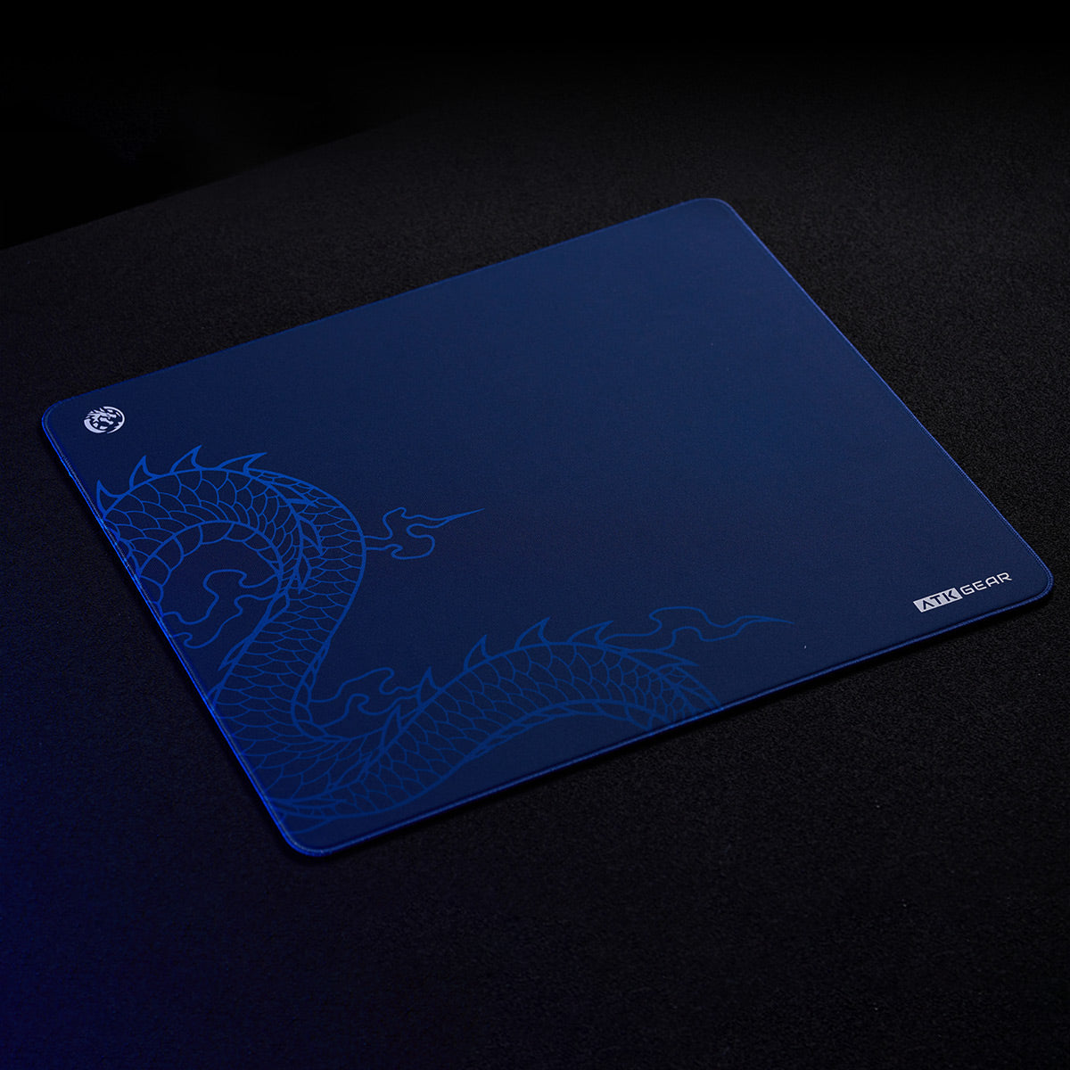 ATK x LEVIATAN navy blue esports gaming mouse pad with light blue dragon design and ATK GEAR logo.