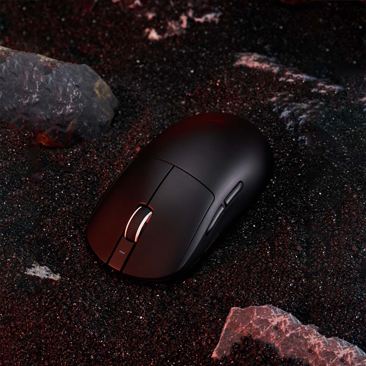 Black ATK Dragonfly A9 wireless gaming mouse with illuminated scroll wheel on a textured dark surface.