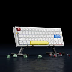 White ATK RS6 65% Hall Effect gaming keyboard, red ESC, blue ENTER, yellow spacebar, stand, spare keycaps, switches.