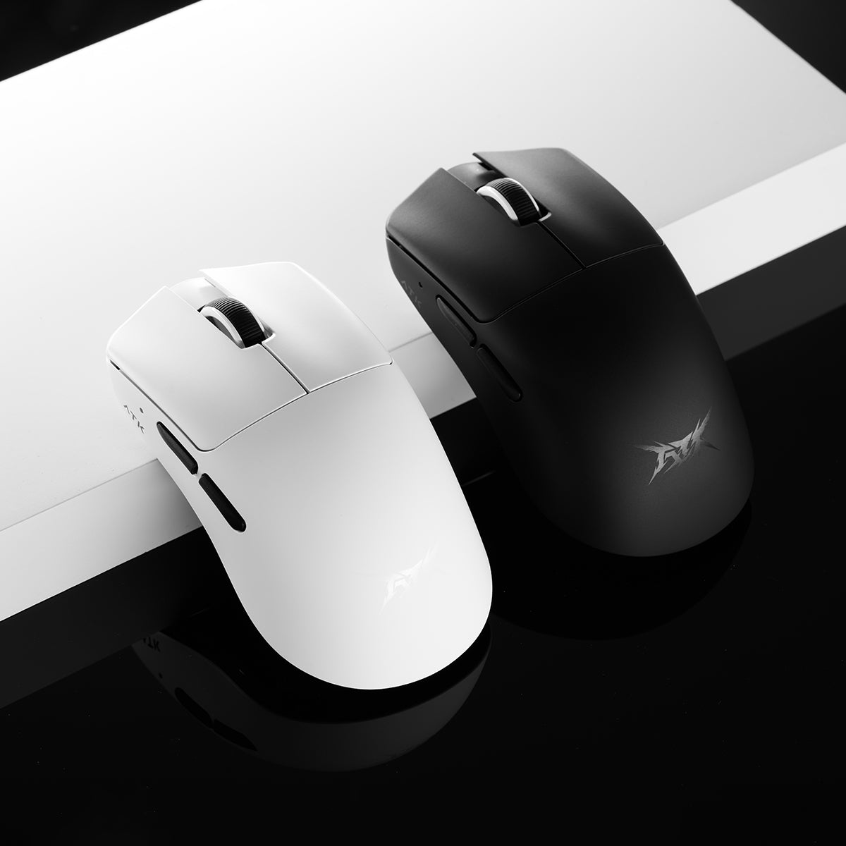 ATK Blazing Sky F1 Series wireless gaming mice, matte black and white, ambidextrous, ATK logo.