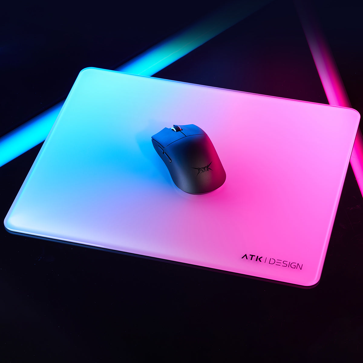 Matte black ATK Blazing Sky F1 Series wireless gaming mouse with ATK logo on a gradient RGB mousepad.