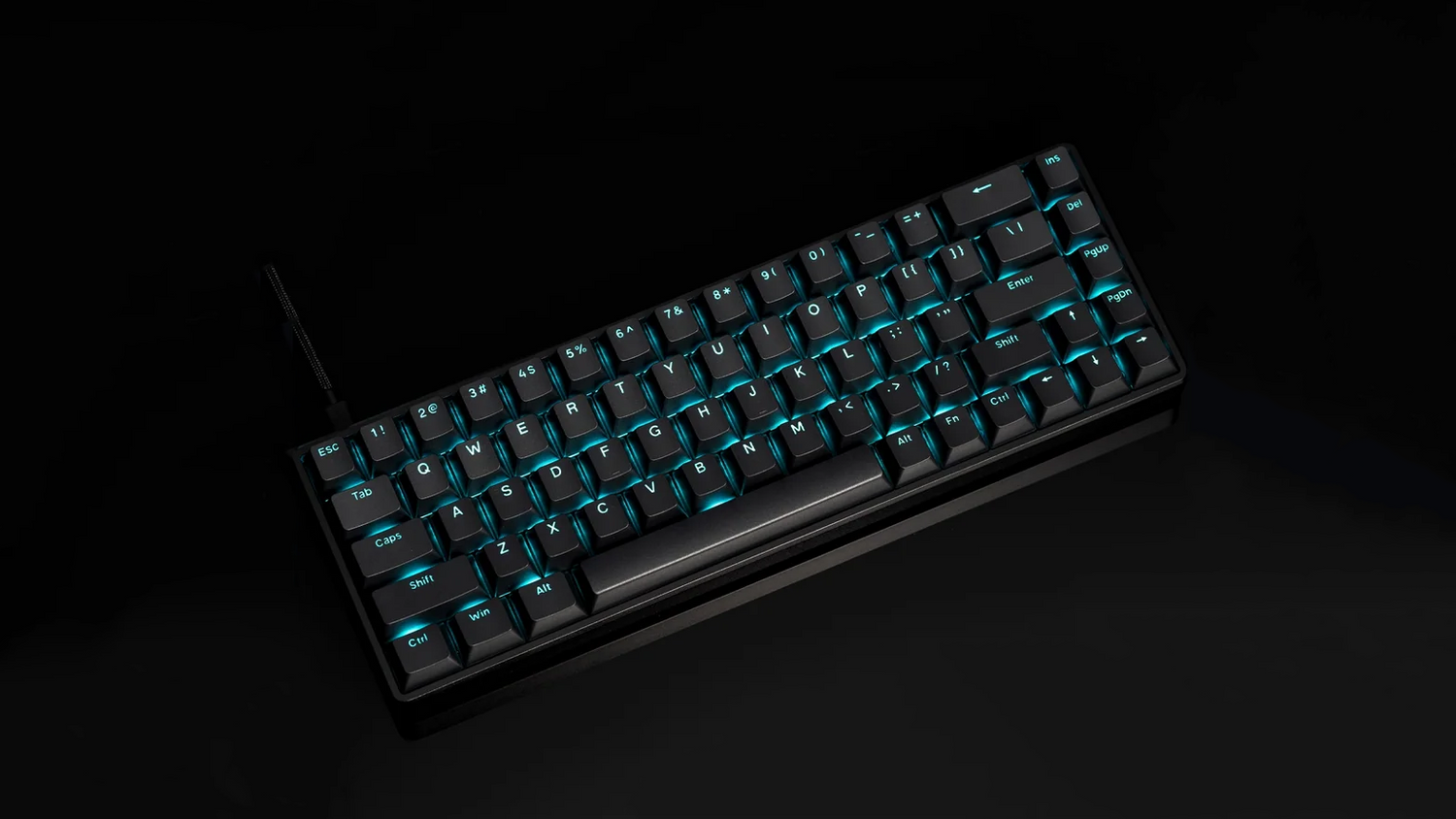 ATK68 mechanical gaming keyboard with cyan RGB backlighting on black keycaps