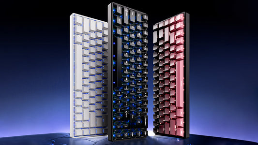 Three mechanical keyboards with different colored keycaps stand against a dark background.