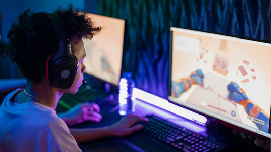 Gamer using a mechanical gaming keyboard during an online PC gaming session