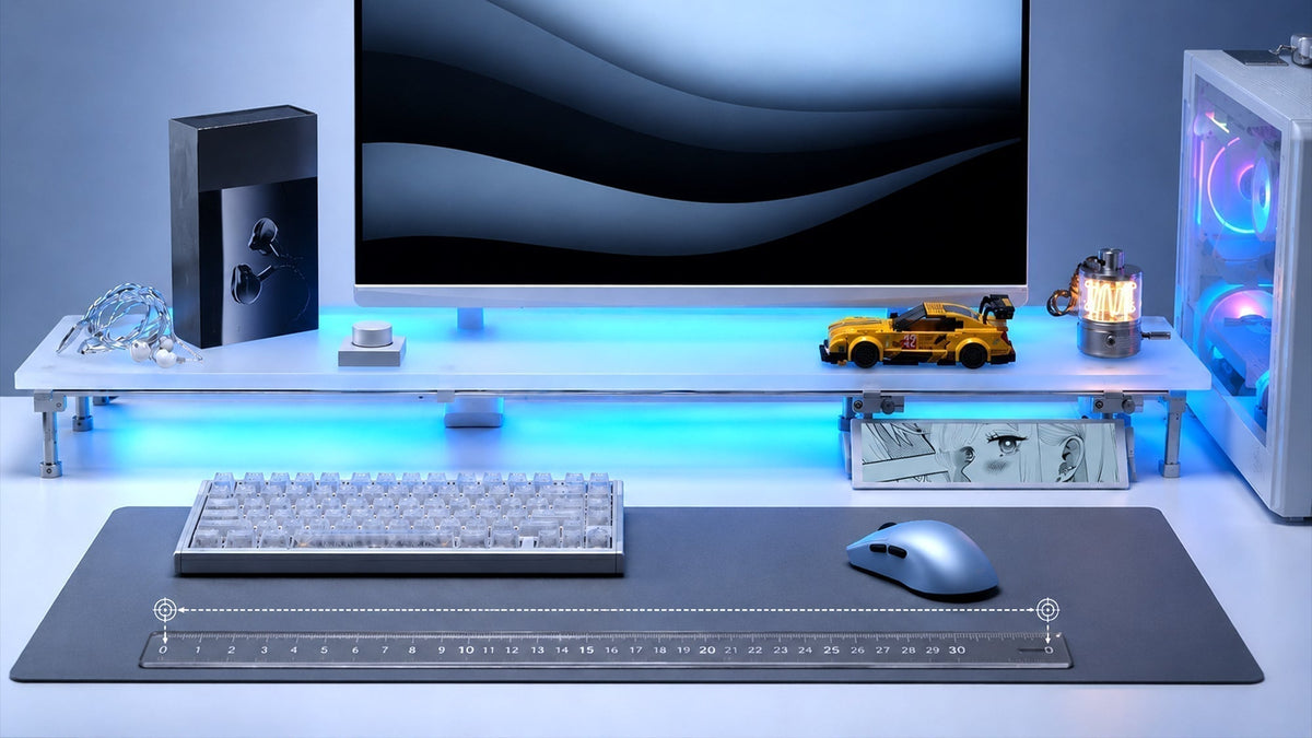 Gaming desk setup with a wireless mouse on a large mouse pad and a 30 cm ruler for measuring physical mouse movement distance