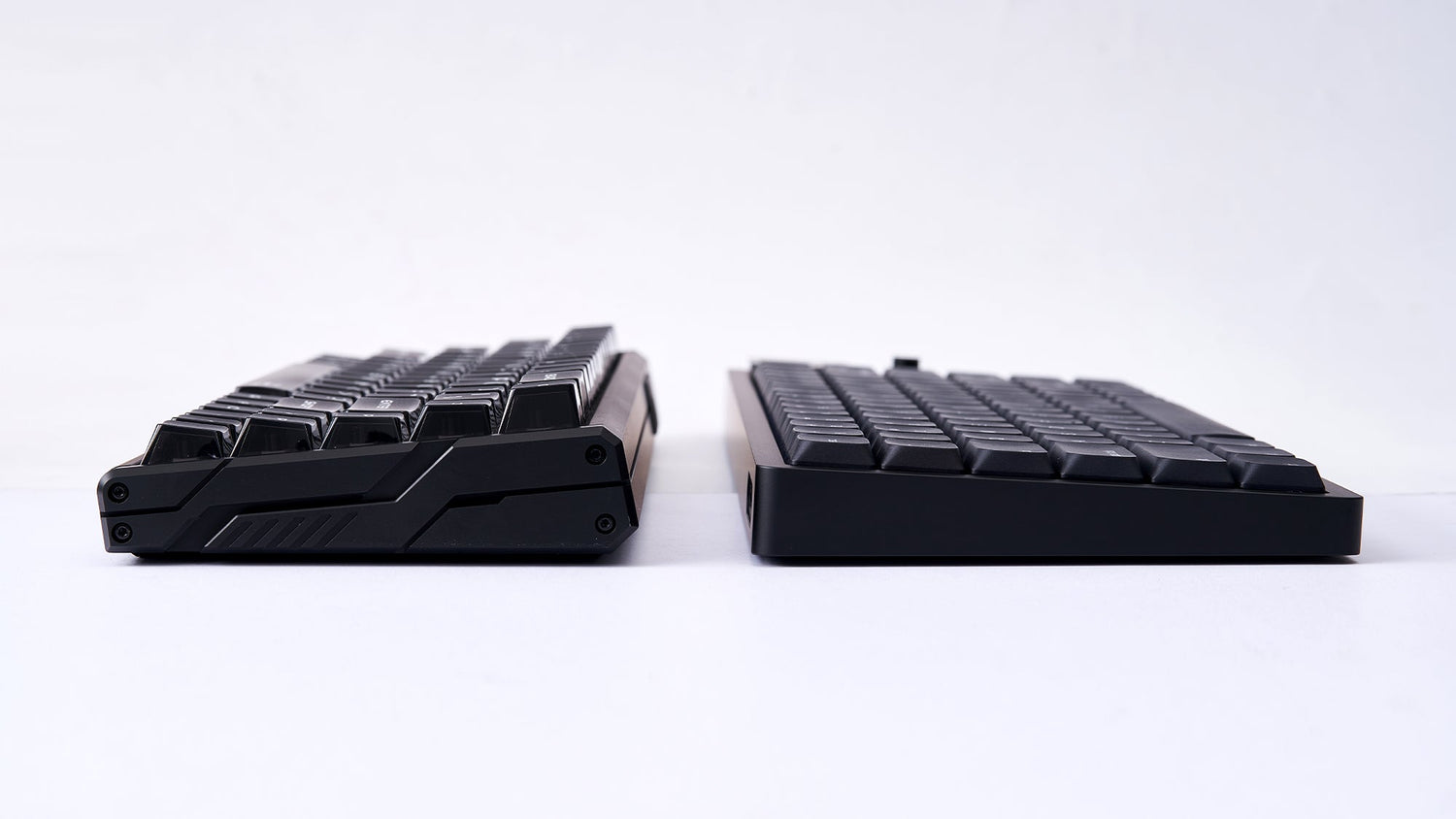 Side profile comparison of a standard mechanical keyboard and a slim low-profile keyboard.