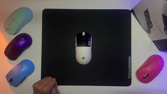 ATK A10 wireless gaming mouse on a black mousepad with colorful mice around it