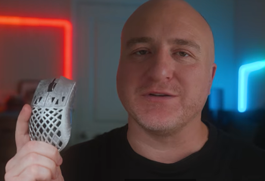 Lightweight wireless gaming mouse shown in hand during product review