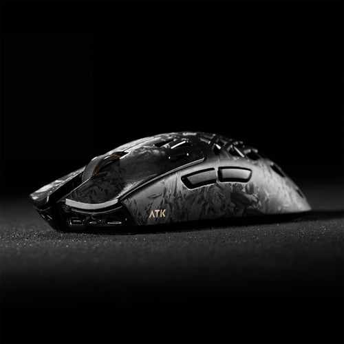 ATK Blazing Sky GHOST hollow carbon fiber wireless gaming mouse with gold accents, side view.