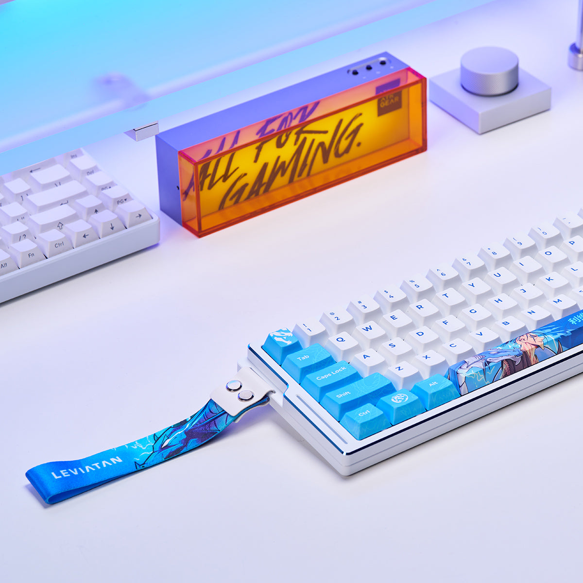 ATK EDGE 60 HE Esports Magnetic Keyboard with blue and white keycaps and Leviathan wrist strap.