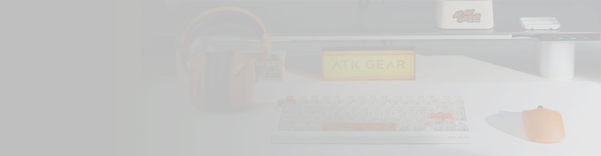 A complete ATK desk setup with keyboard, mouse and headset